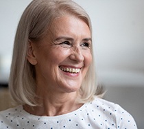 woman smiling after getting dental implants