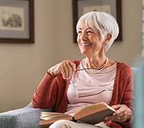 woman smiling after getting dental implants