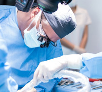 an oral surgeon performing dental implant placement