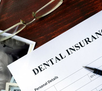 a dental insurance form next to an X-ray