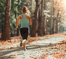 Woman running on trail outside